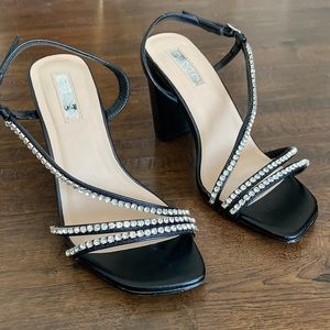 Black block heels with crystal strand embellishment